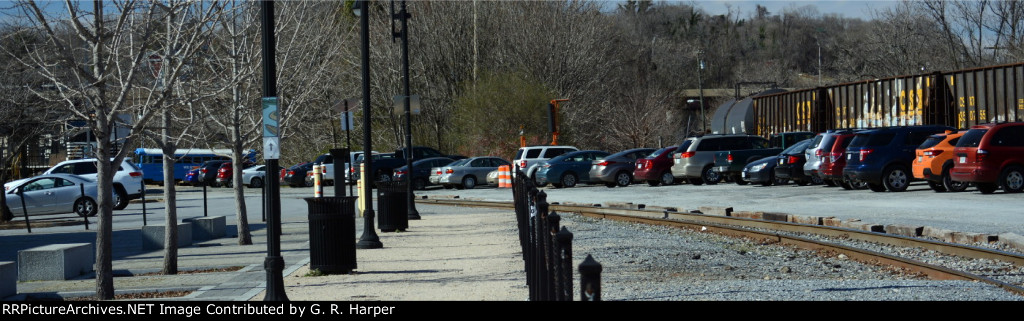 It's hard to see but hidden behind the trees to the left is NS yard job E19 and CSX train L214 is to the right